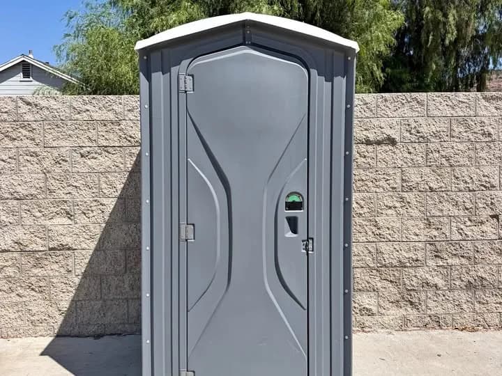 Standard portable toilet exterior with the privacy door closed